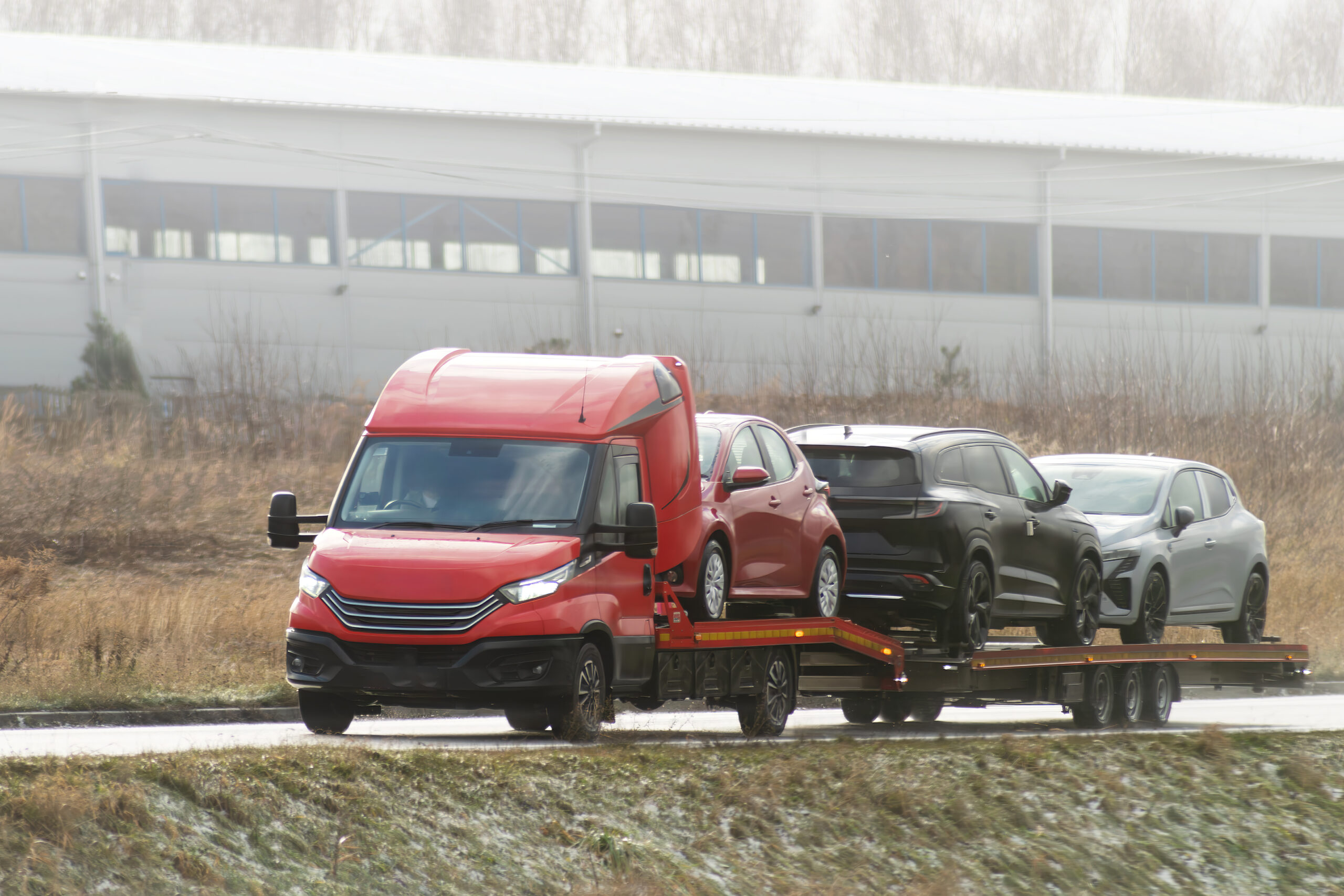 roadside-assistance-service-country-road-tow-truck-is-carrying-car-that-has-been-involved-traffic-accident-has-broken-engine