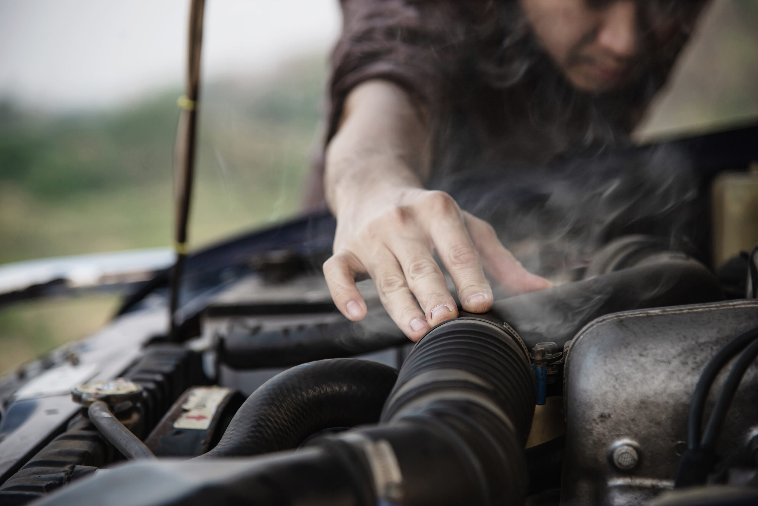 man-try-fix-car-engine-problem-local-road (3)