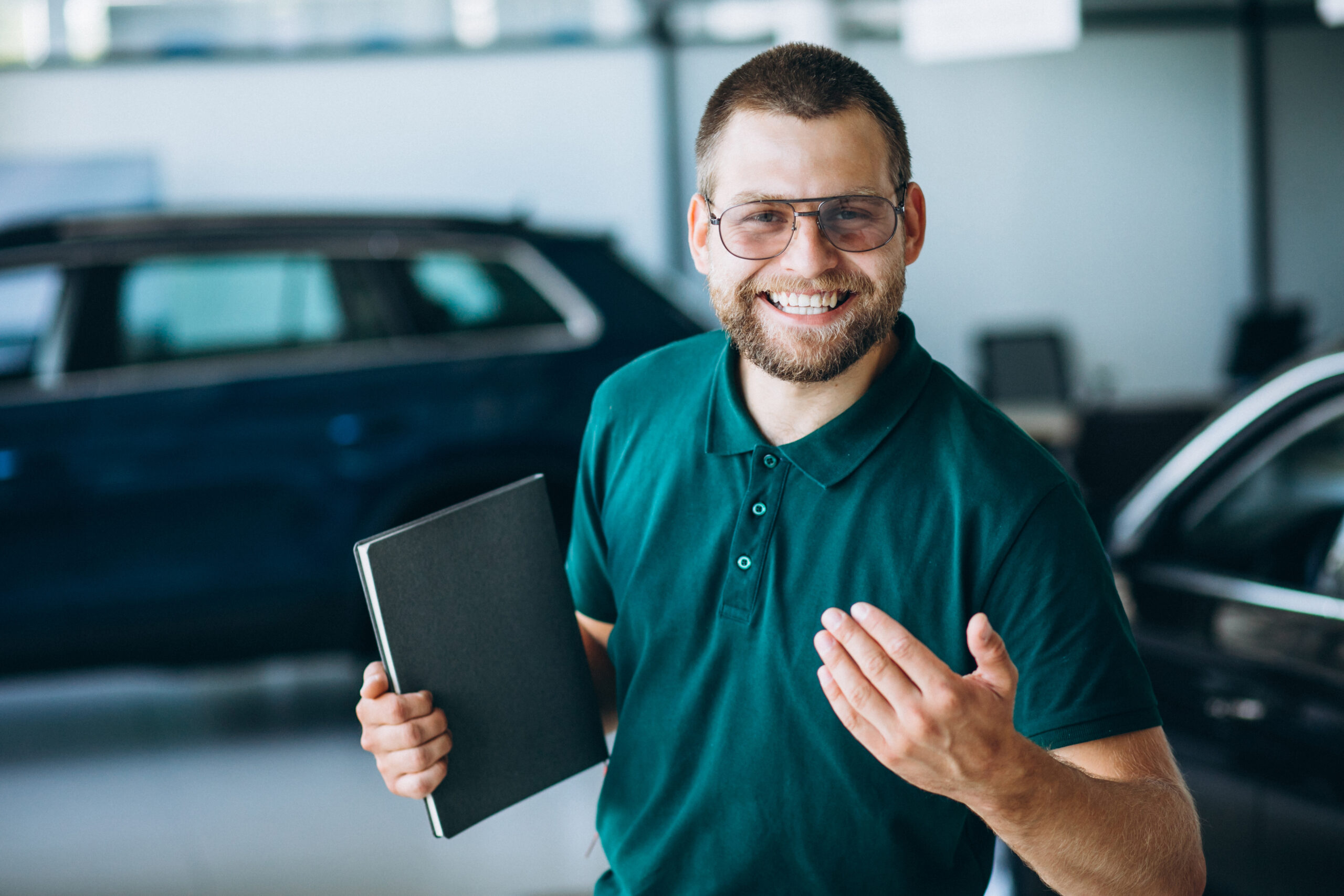 Sales man in a car showroom selling a car